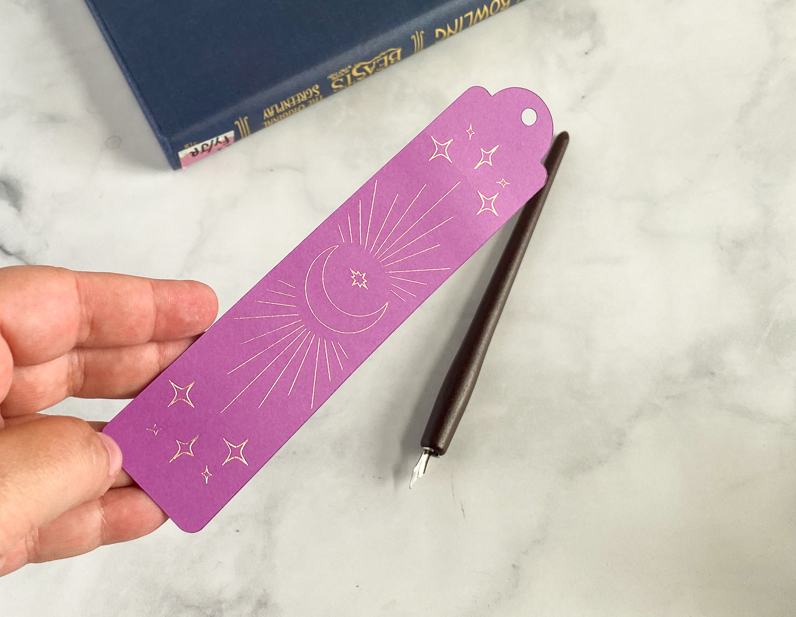 purple bookmark with gold moon design