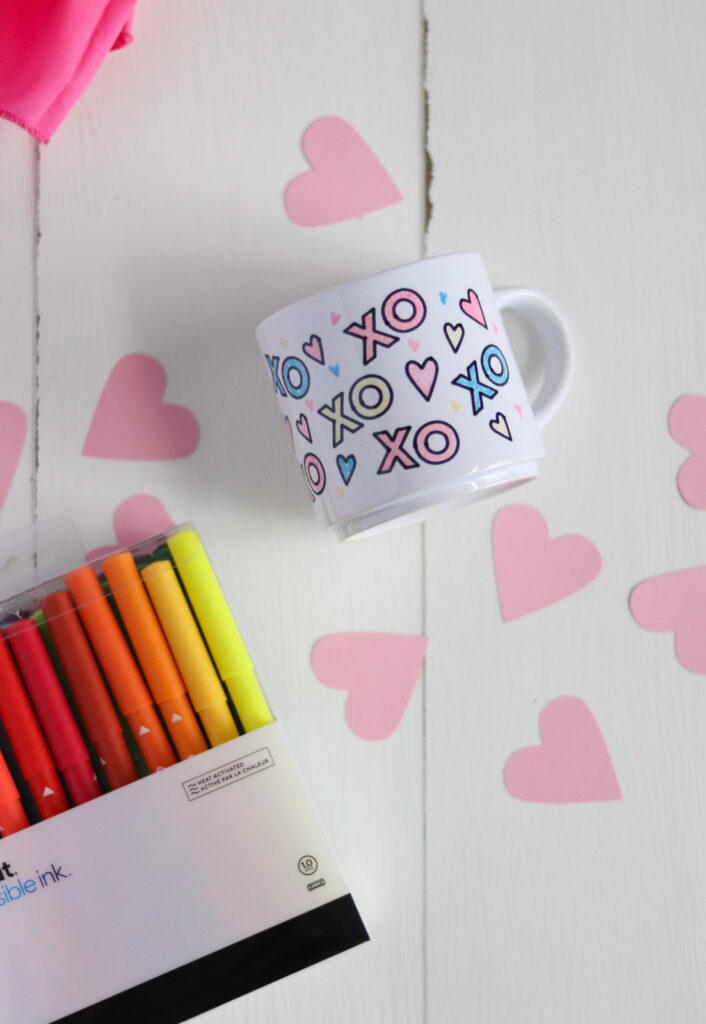 XOXO design on mug and markers