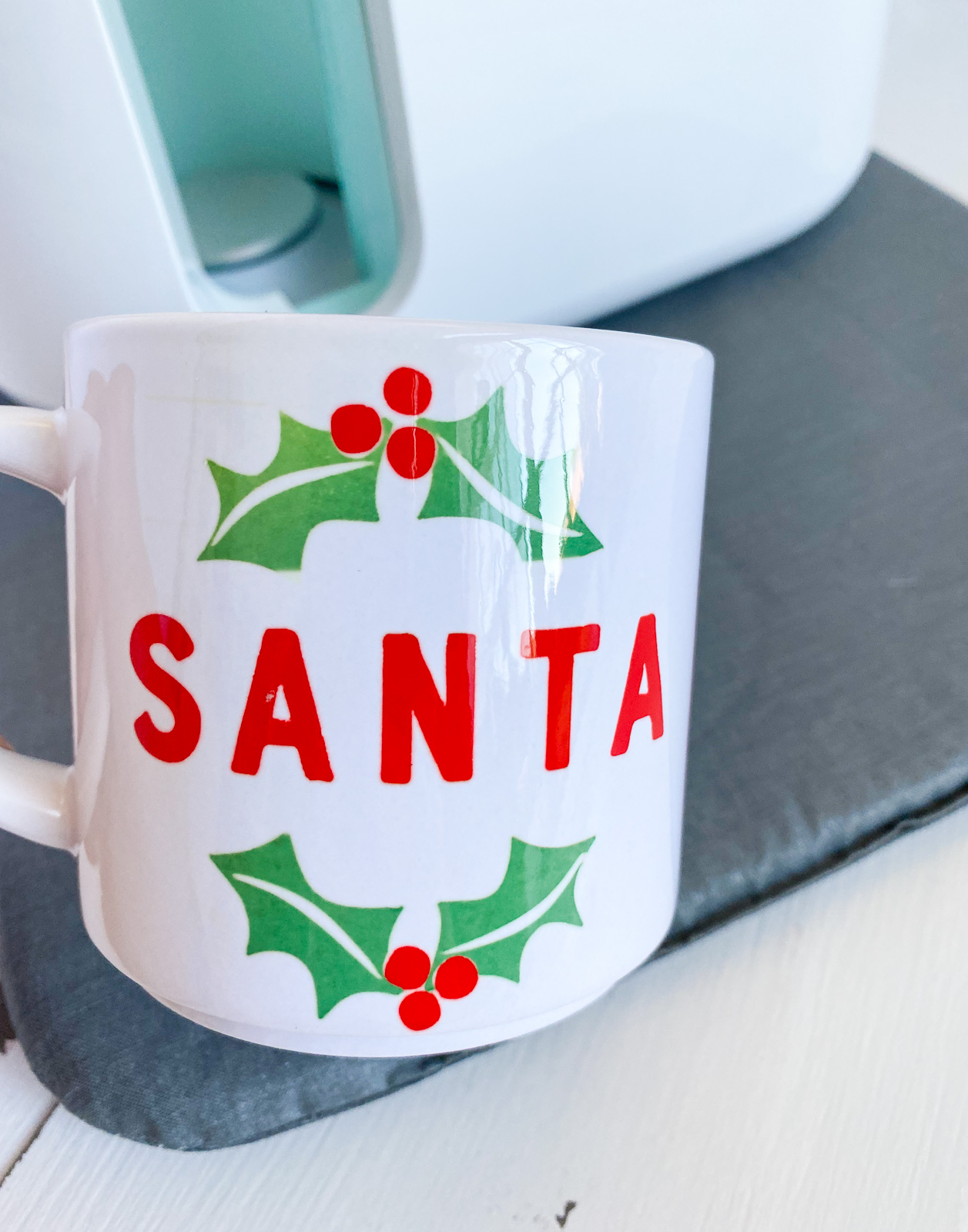 Santa mug with cricut mug press in background