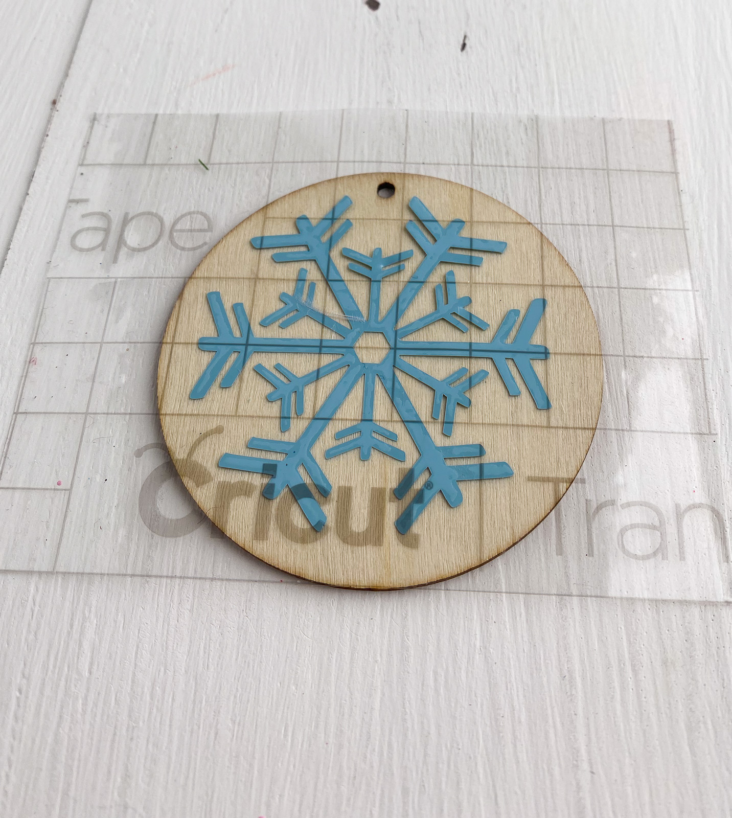blue snowflake design on wood ornament blank