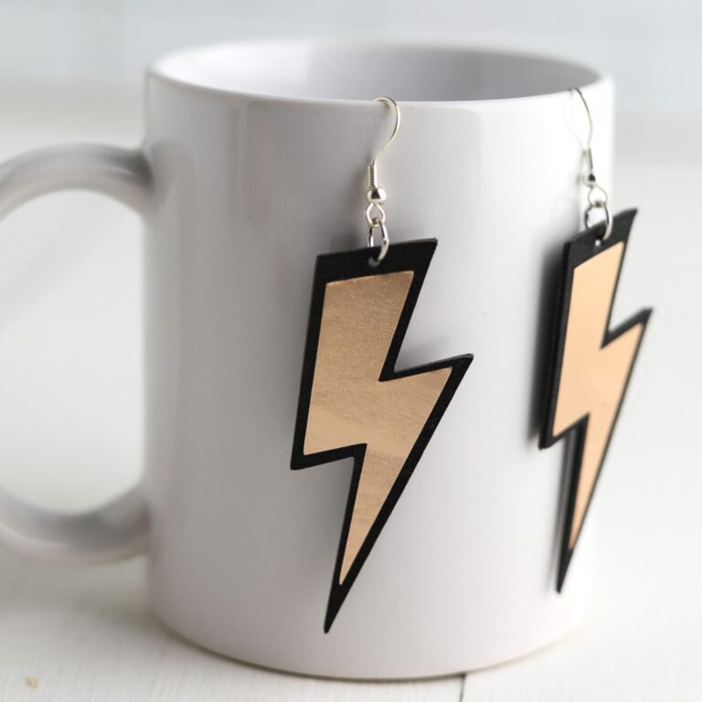 lightning bolt earrings on coffee cup