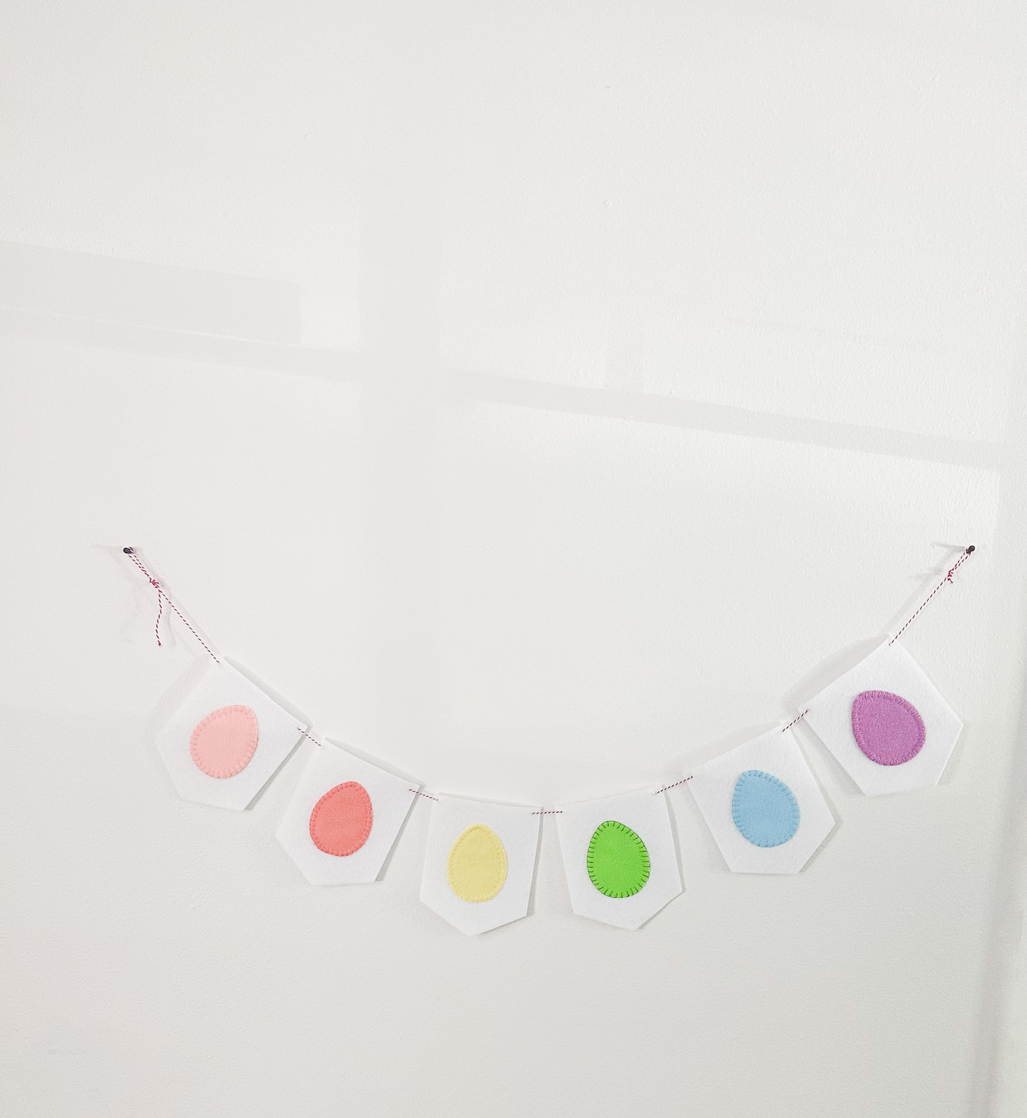 easter egg banner hung on wall